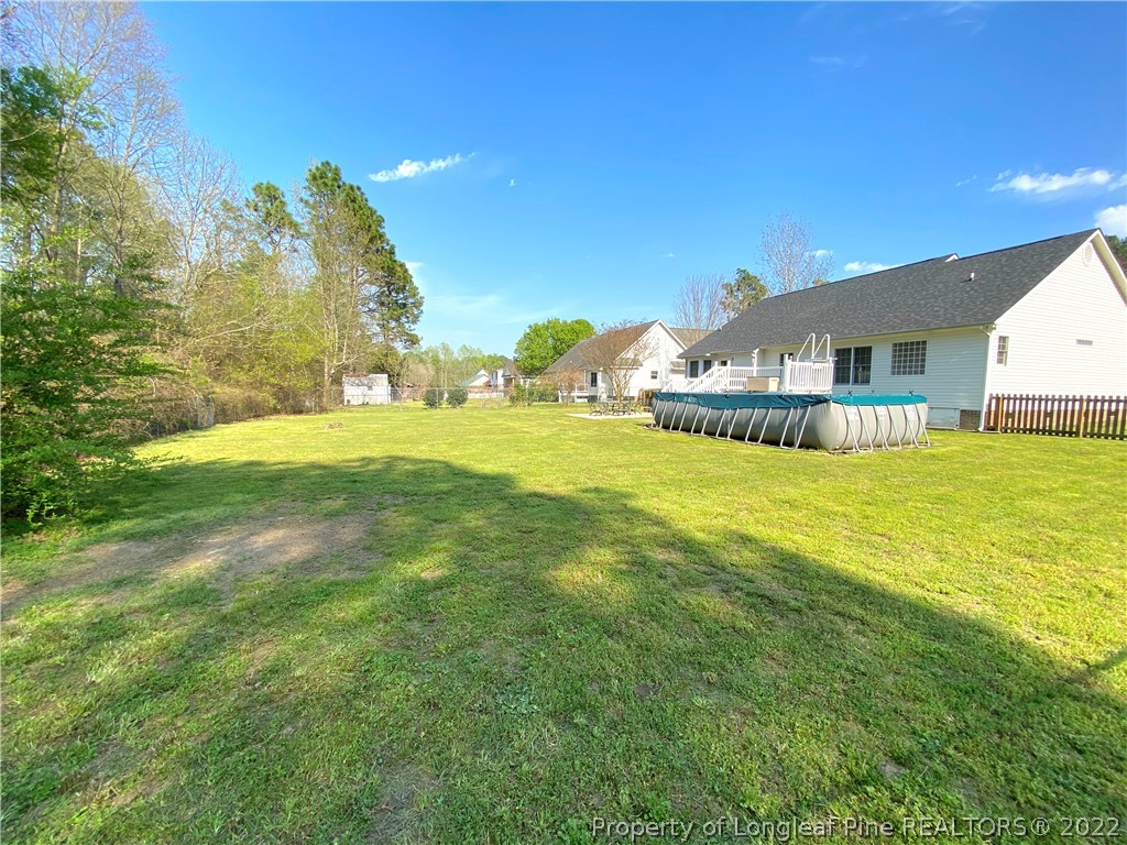 271 Stone Cross Drive Spring Lake, NC 28390 - Photo 36 of 38 a view of an house with a big yard