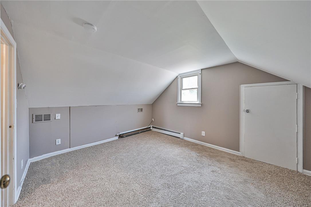 3050 Cornwall Road Bethlehem, PA 18017 - Photo 40 of 80 A well-lit attic space offers a private retreat with sloped ceilings and plush carpeting.