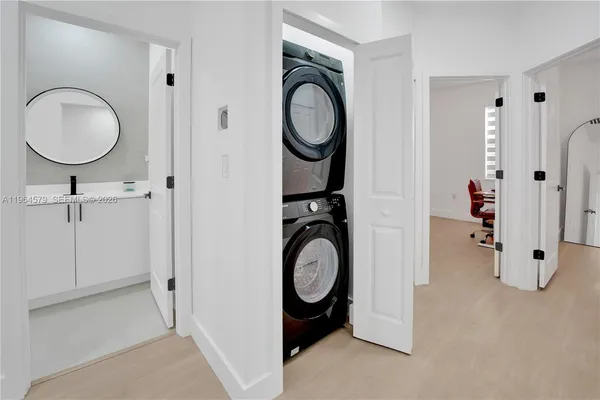 a bathroom with a mirror a sink and a mirror