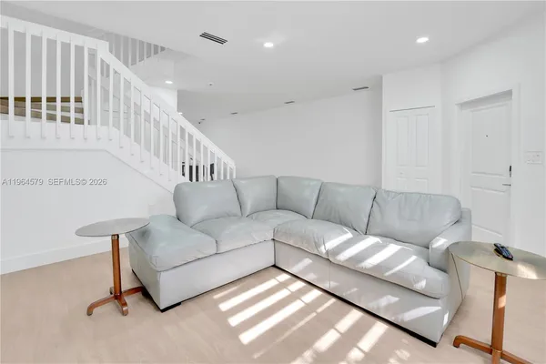 a living room with furniture and a couch