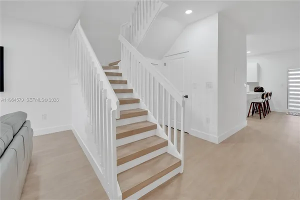 a view of a hallway with staircase