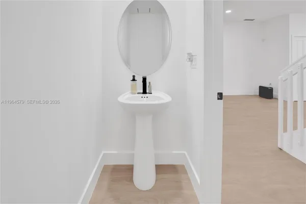 a bathroom with a sink and a mirror