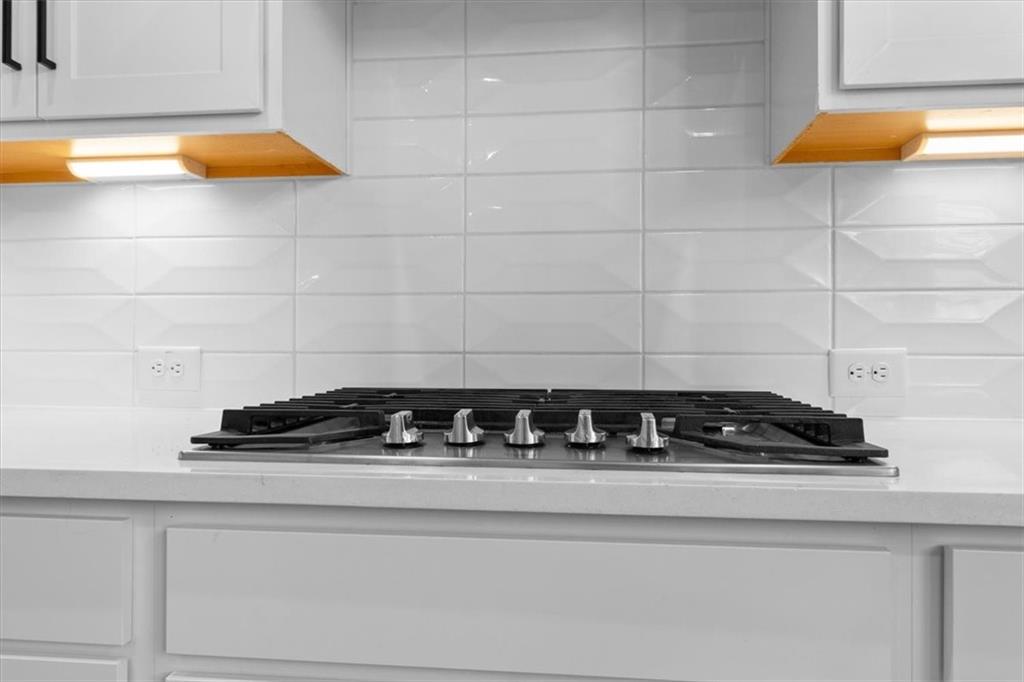 3376 Macaiva Alley Avondale Estates, GA 30002 - Photo 11 of 42 a close view of a stove a sink and a cabinet