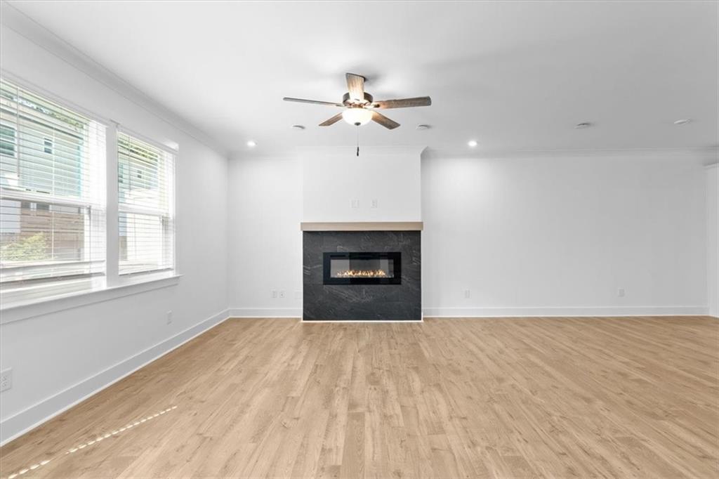 3376 Macaiva Alley Avondale Estates, GA 30002 - Photo 15 of 42 a view of empty room with wooden floor and fan