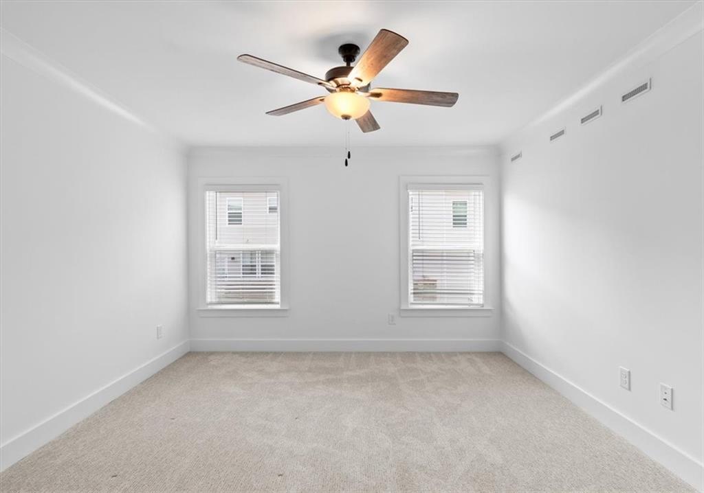 3376 Macaiva Alley Avondale Estates, GA 30002 - Photo 18 of 42 an empty room with window and ceiling fan