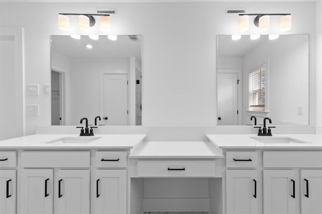 3376 Macaiva Alley Avondale Estates, GA 30002 - Photo 23 of 42 a bathroom with a sink vanity and a mirror