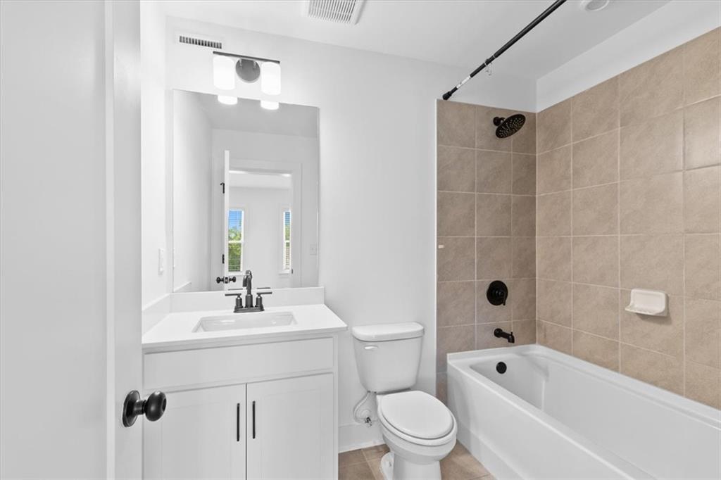 3376 Macaiva Alley Avondale Estates, GA 30002 - Photo 27 of 42 a bathroom with a bathtub shower sink mirror vanity and toilet
