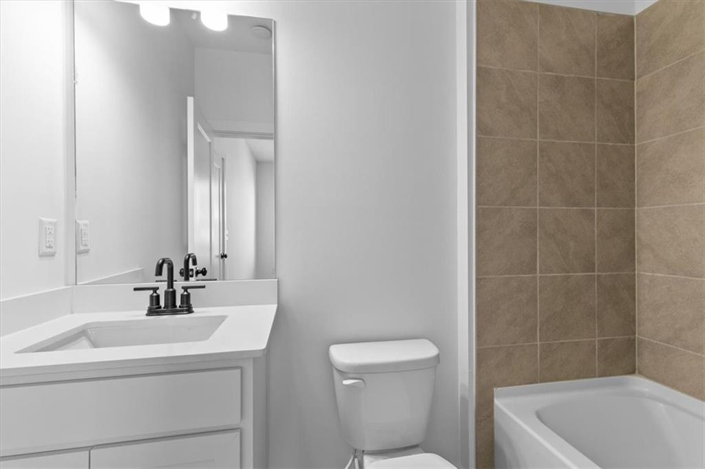 3376 Macaiva Alley Avondale Estates, GA 30002 - Photo 31 of 42 a bathroom with a sink a toilet and shower