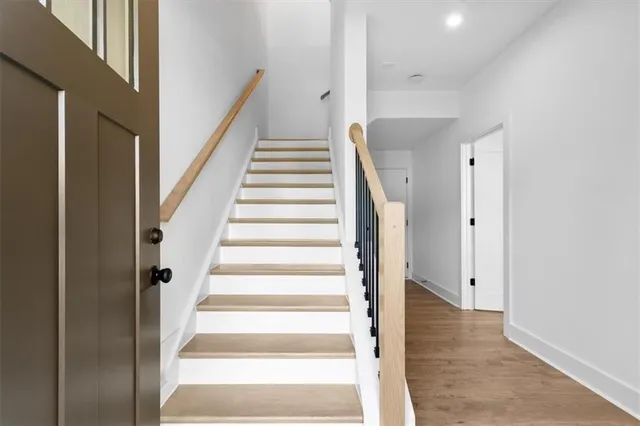 a view of an entryway with wooden floor