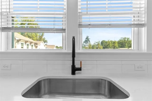 a close view of a stove a sink and a cabinet
