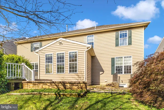 a sign that is sitting in front of flowers