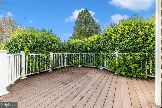 an aerial view of residential houses with outdoor space and swimming pool
