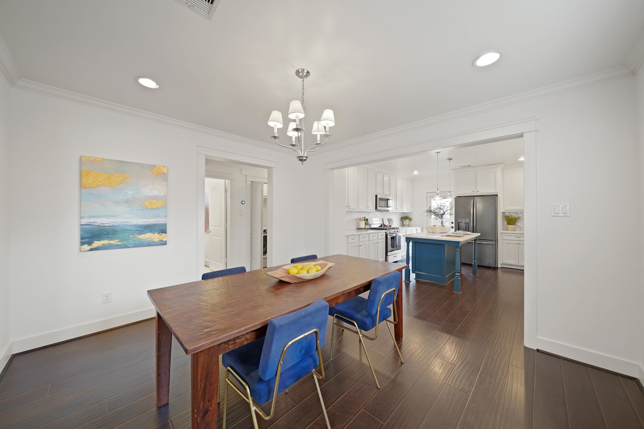 1311 Walton Street Houston, TX 77009 - Photo 11 of 43 Beyond the dining area, a hallway leads to the bedrooms, offering a natural flow while still giving each room its own quiet retreat.