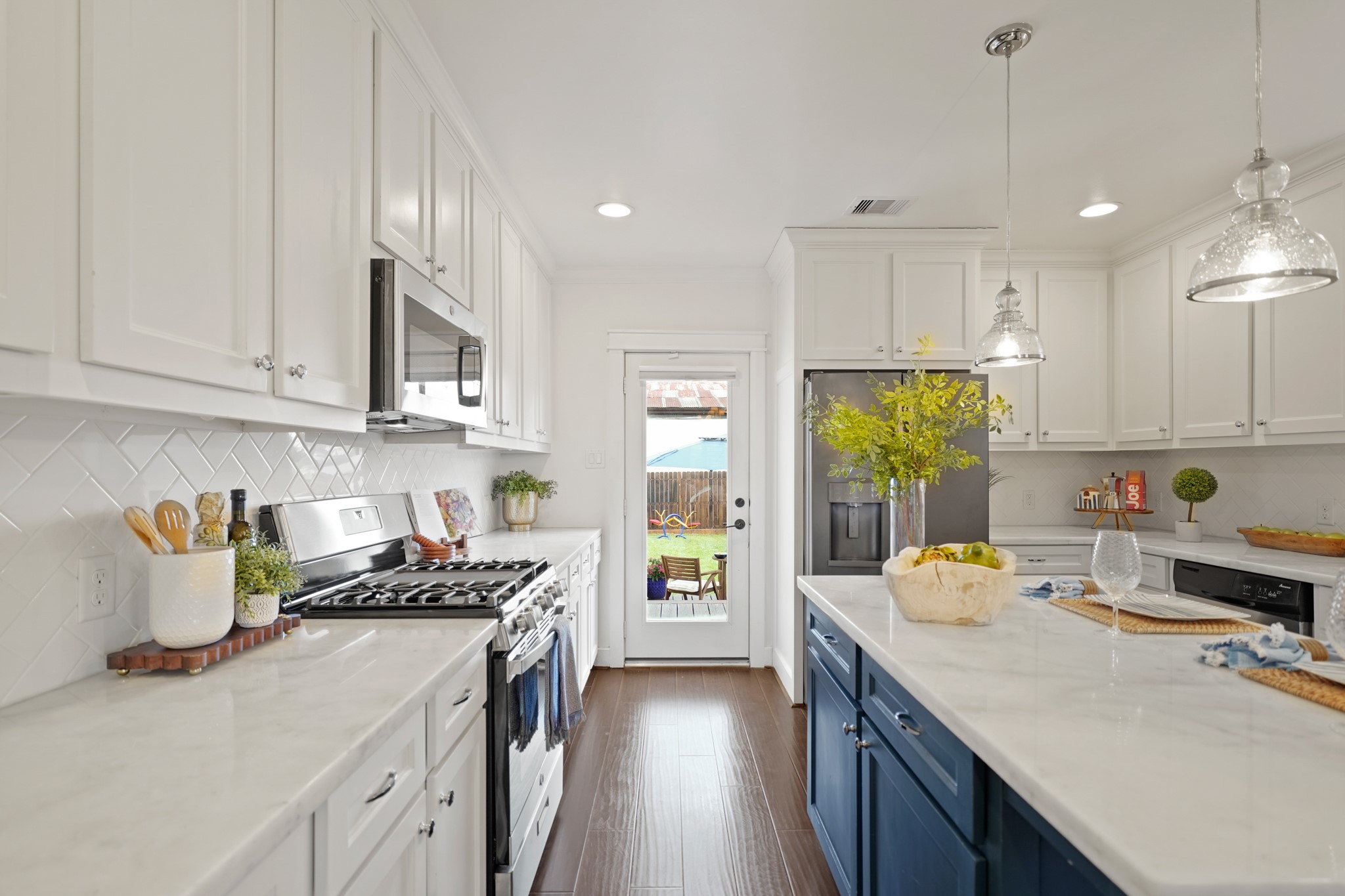 1311 Walton Street Houston, TX 77009 - Photo 15 of 43 A patio door leads straight to the backyard making outdoor meals or gatherings feel like a natural extension of the home.