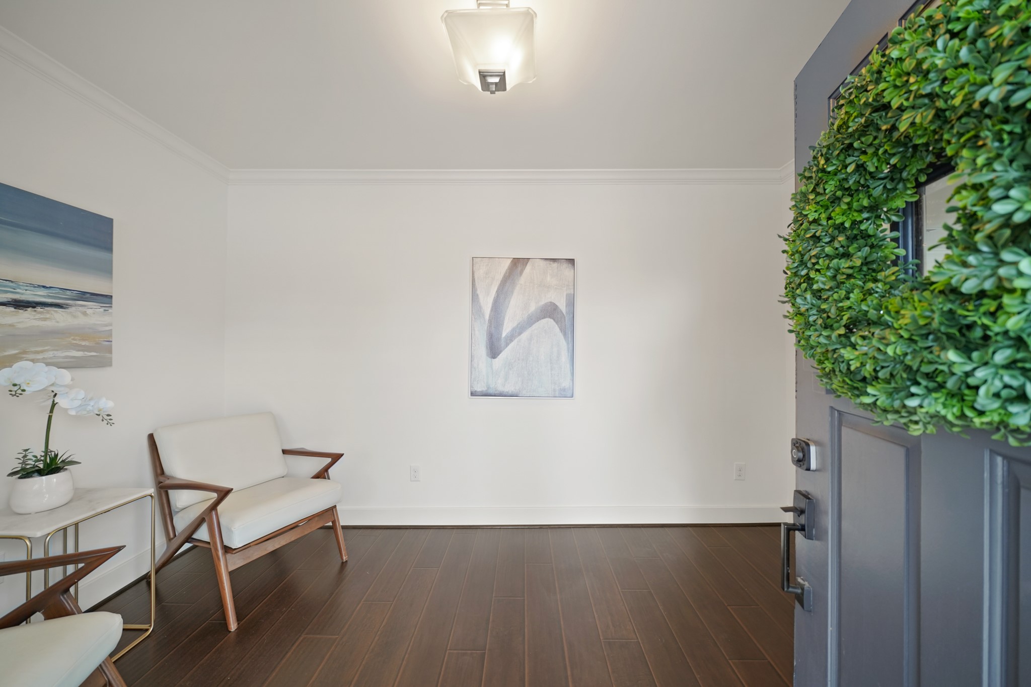 1311 Walton Street Houston, TX 77009 - Photo 3 of 43 Step inside and you’re greeted by fresh interior paint and a warm and inviting entryway featuring engineered hardwood floors throughout and a large, shuttered window that lets the natural light in.