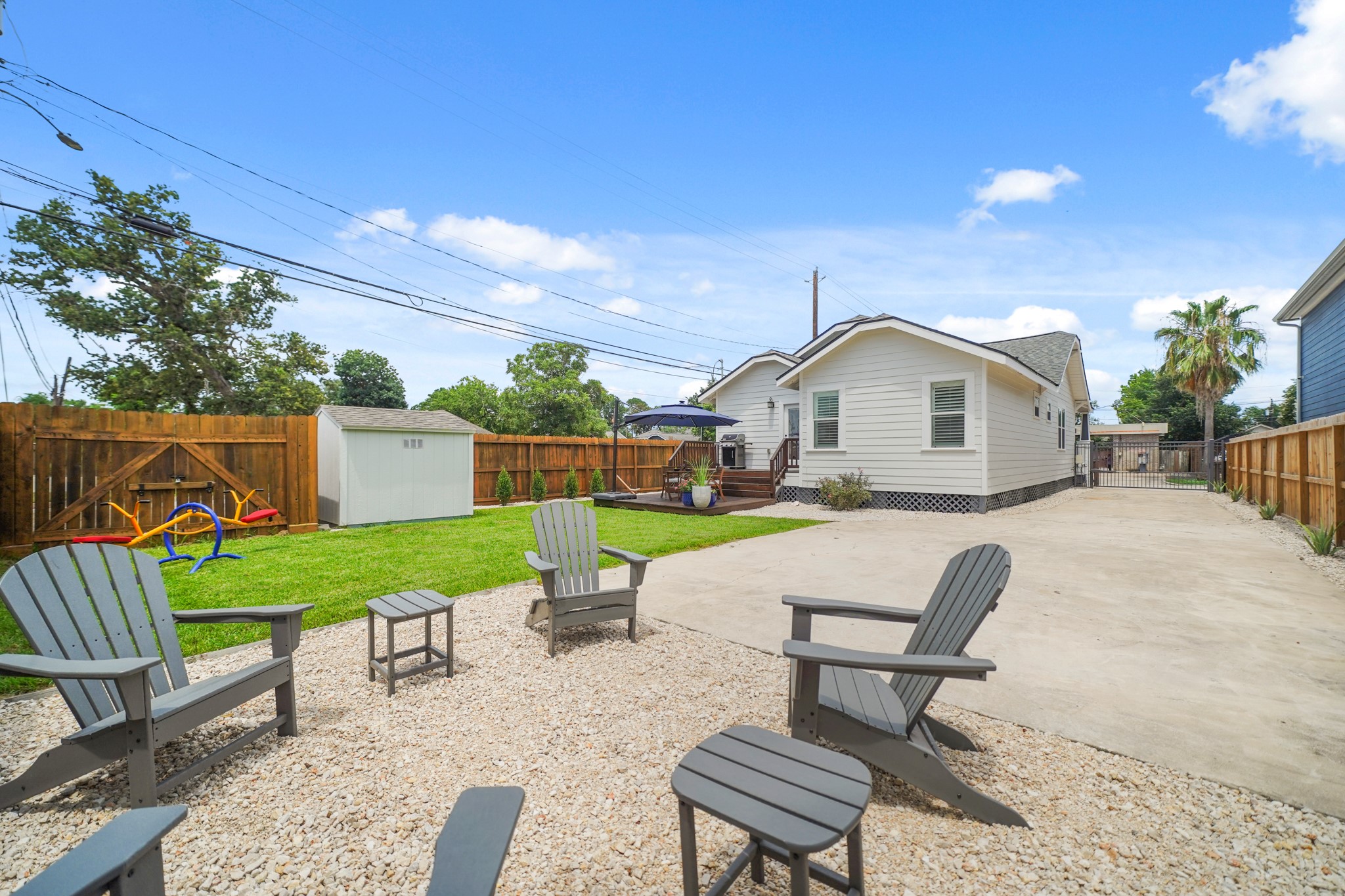 1311 Walton Street Houston, TX 77009 - Photo 33 of 43 A view from the second backyard patio area of this spacious yard and driveway.
