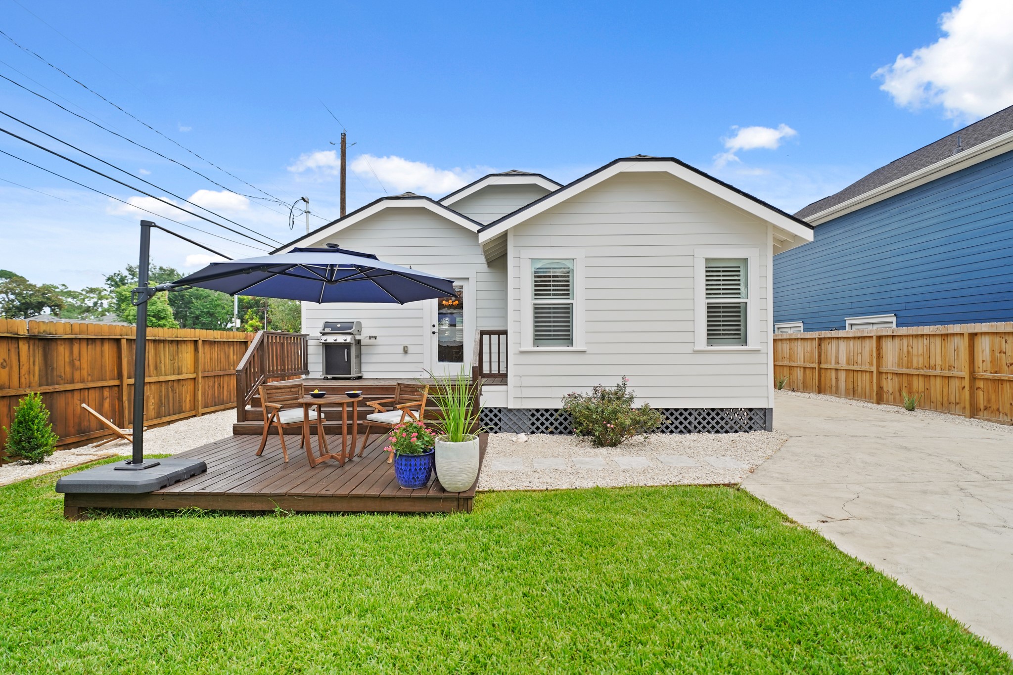1311 Walton Street Houston, TX 77009 - Photo 37 of 43 The back of the home features clean lines and a two-tieredl deck that blends beautifully with the outdoor space and is perfect for entertaining, unwinding, or simply enjoying the backyard view