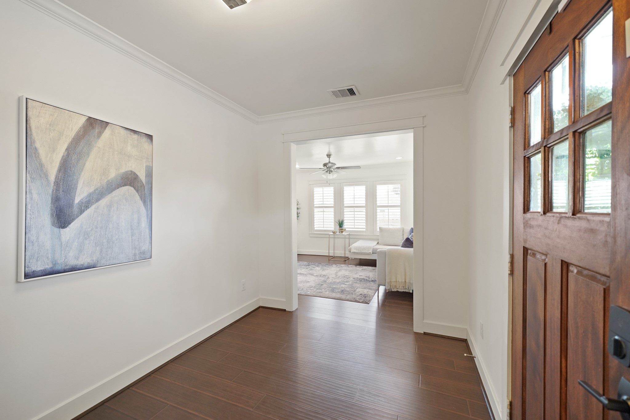 1311 Walton Street Houston, TX 77009 - Photo 5 of 43 From the foyer, the space flows seamlessly into the living room, creating an open and inviting area that’s perfect for everyday living or entertaining guests.