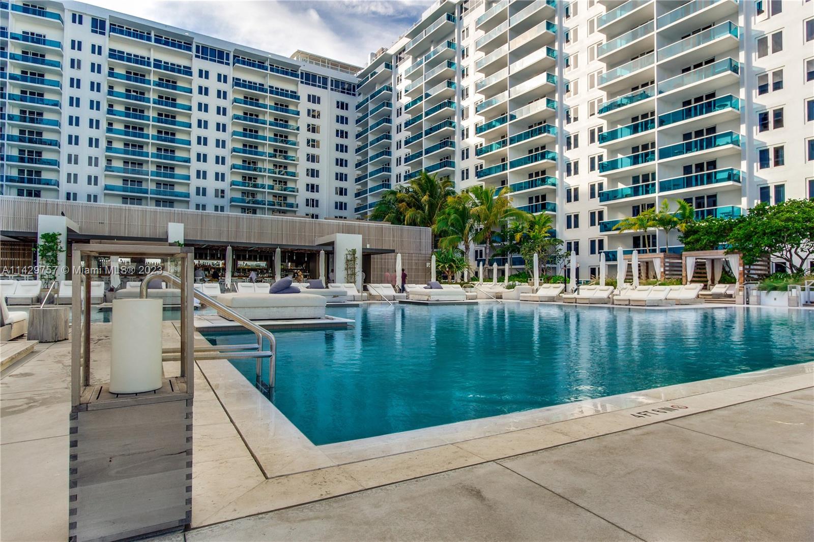 102 24th Street, Unit 1013 Miami Beach, FL 33139 - Photo 12 of 38 front view of a building with a garden