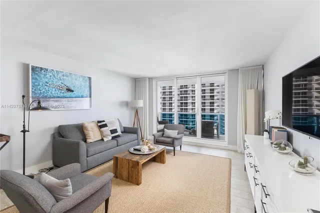 a view of livingroom with furniture and flat screen tv