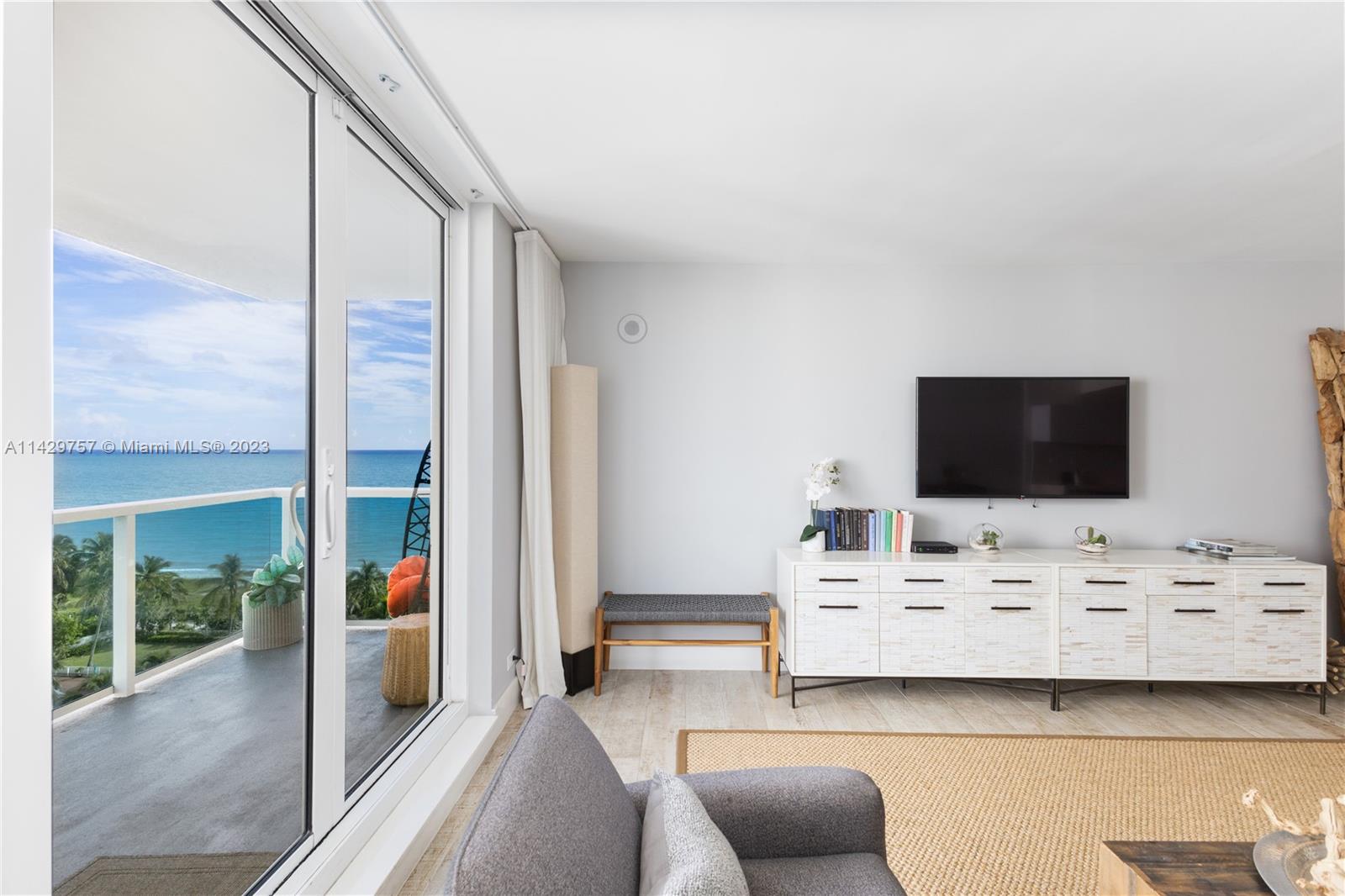 102 24th Street, Unit 1013 Miami Beach, FL 33139 - Photo 22 of 38 a view of livingroom with furniture and flat screen tv