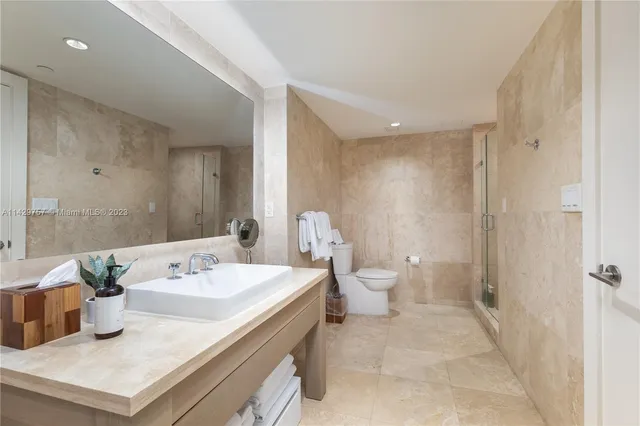 a balcony with furniture and city view