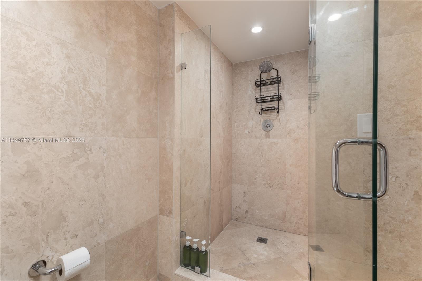 102 24th Street, Unit 1013 Miami Beach, FL 33139 - Photo 34 of 38 a bathroom with a shower