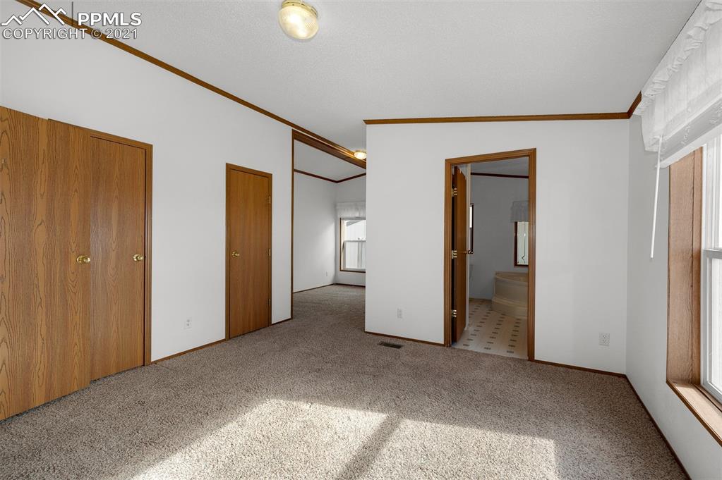 4270 Oil Well Road Yoder, CO 80864 - Photo 22 of 42 The master bedroom has 2 closets, a sitting room and a private bath.