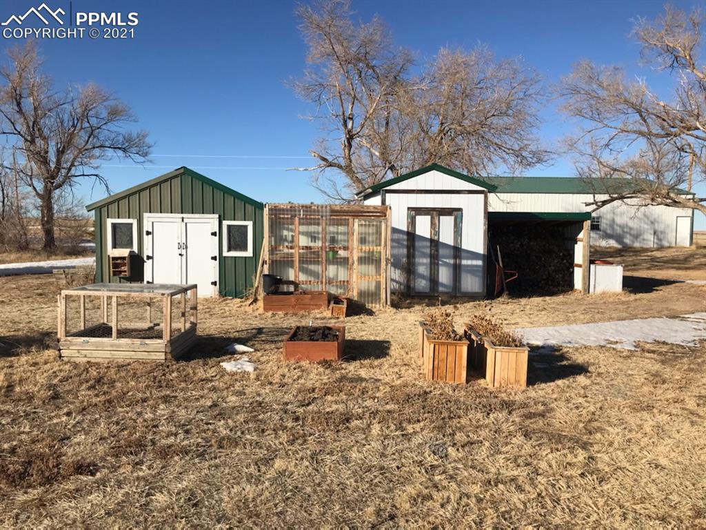 4270 Oil Well Road Yoder, CO 80864 - Photo 28 of 42 Raided, covered garden beds, greenhouse and sheds.