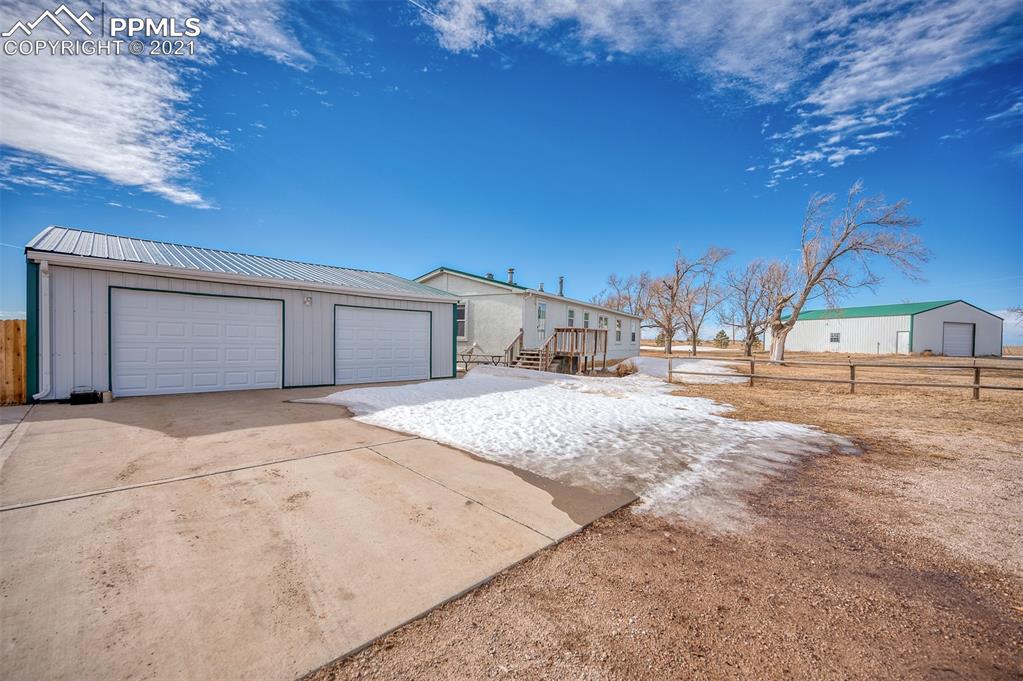 4270 Oil Well Road Yoder, CO 80864 - Photo 6 of 42 The 2 car detached garage has a concrete floor and parking area. The garage is insulated and has electricity.
