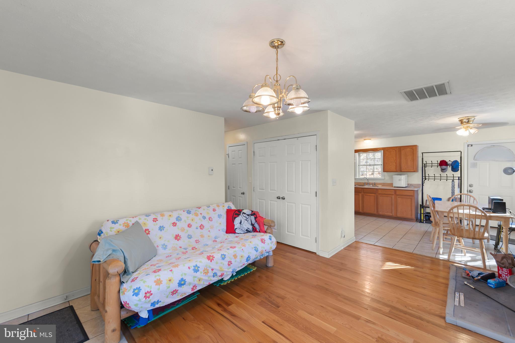 1060 Buffalo Rdg Road Augusta, WV 26704 - Photo 13 of 67 a bedroom with bed and wooden floor