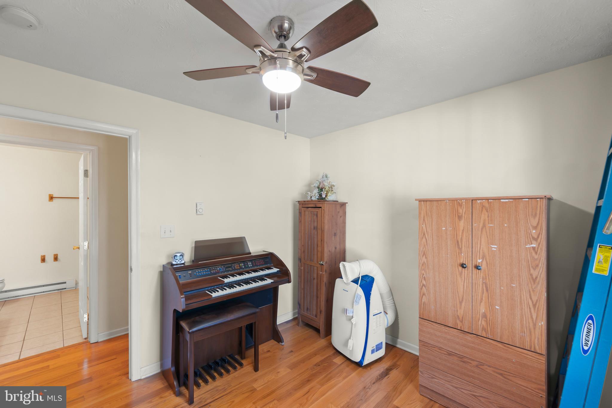 1060 Buffalo Rdg Road Augusta, WV 26704 - Photo 19 of 67 a view of a workspace with furniture and wooden floor