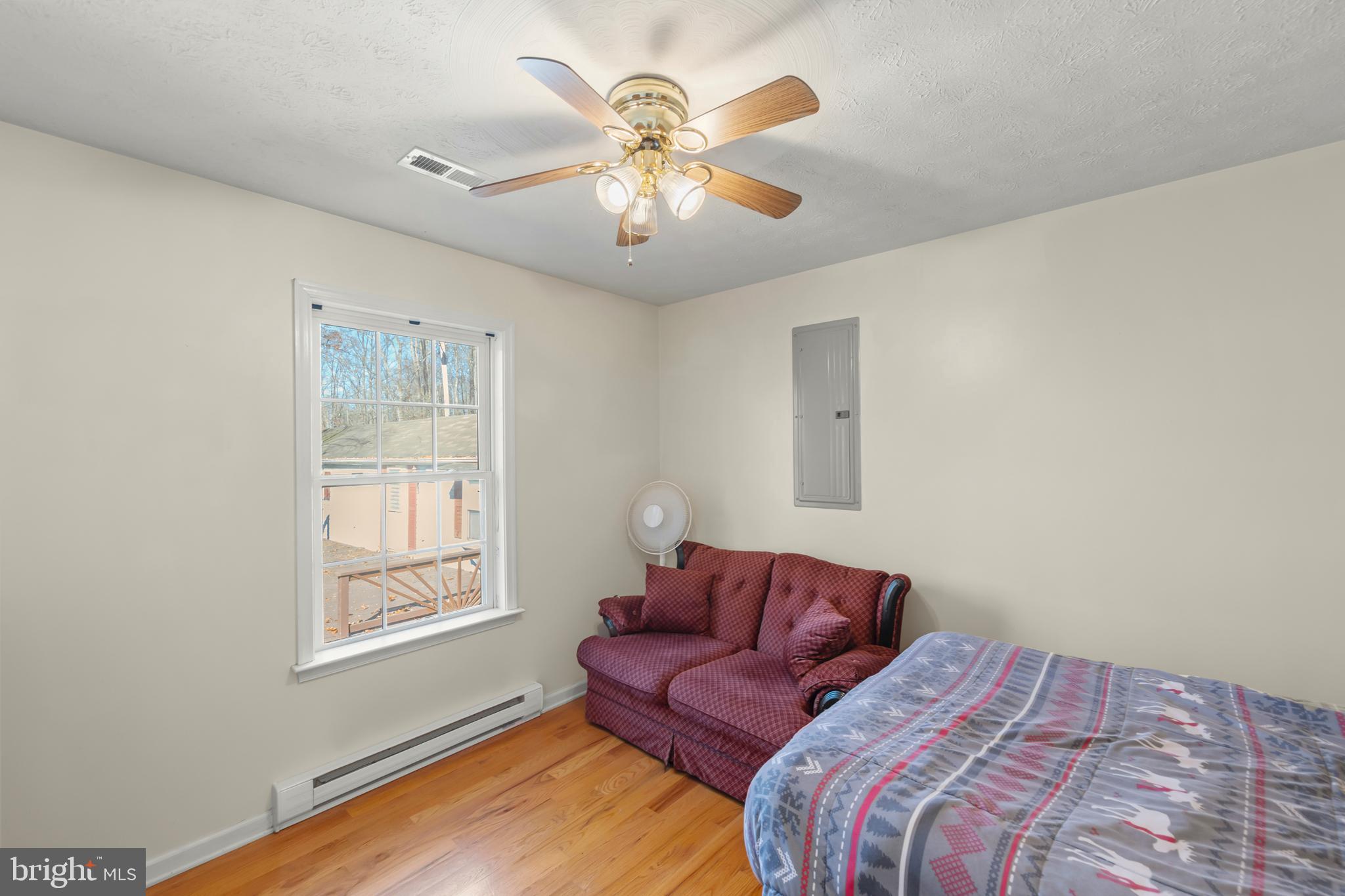 1060 Buffalo Rdg Road Augusta, WV 26704 - Photo 21 of 67 a bedroom with a large bed and a window