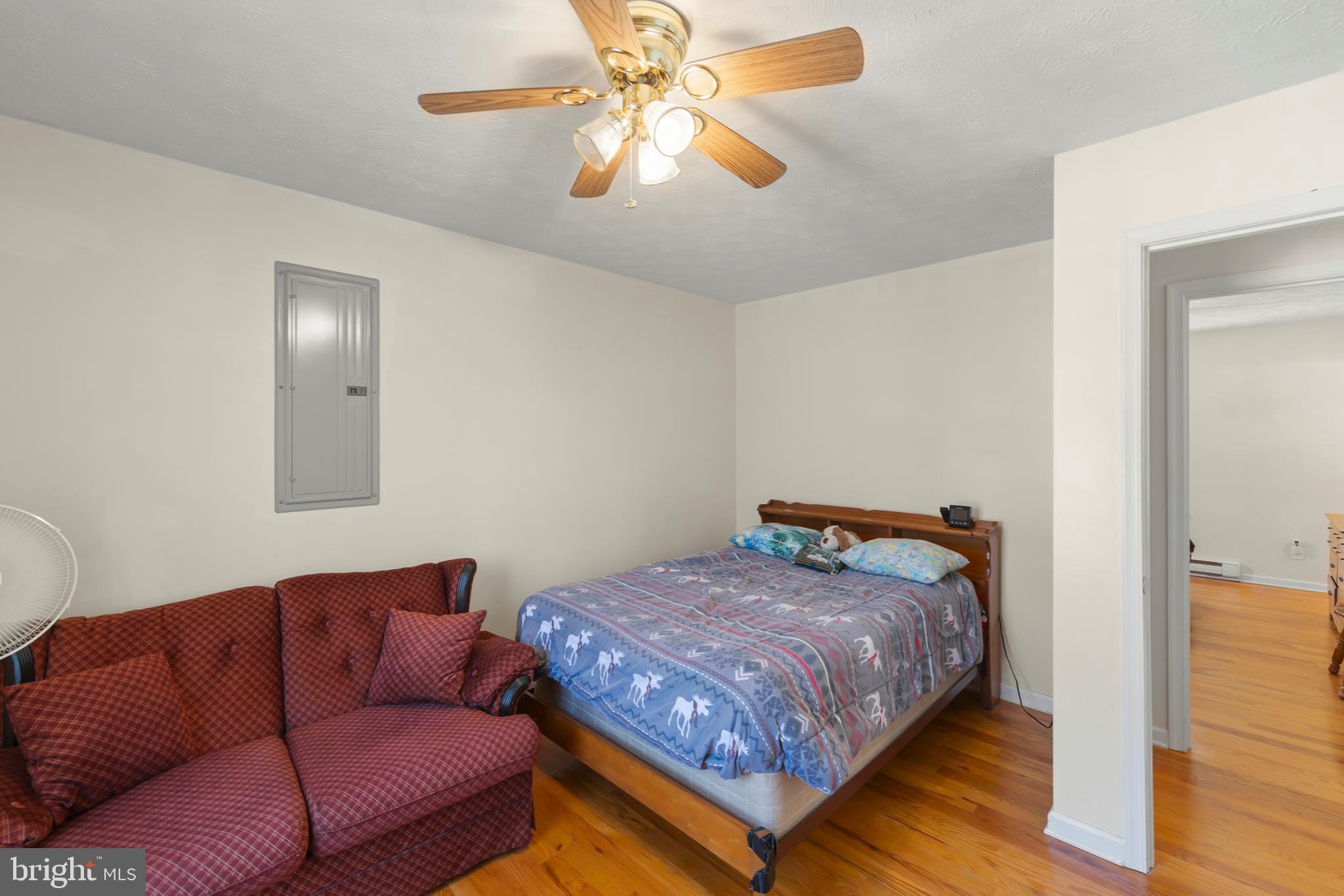 1060 Buffalo Rdg Road Augusta, WV 26704 - Photo 22 of 67 a bedroom with a bed couch and window