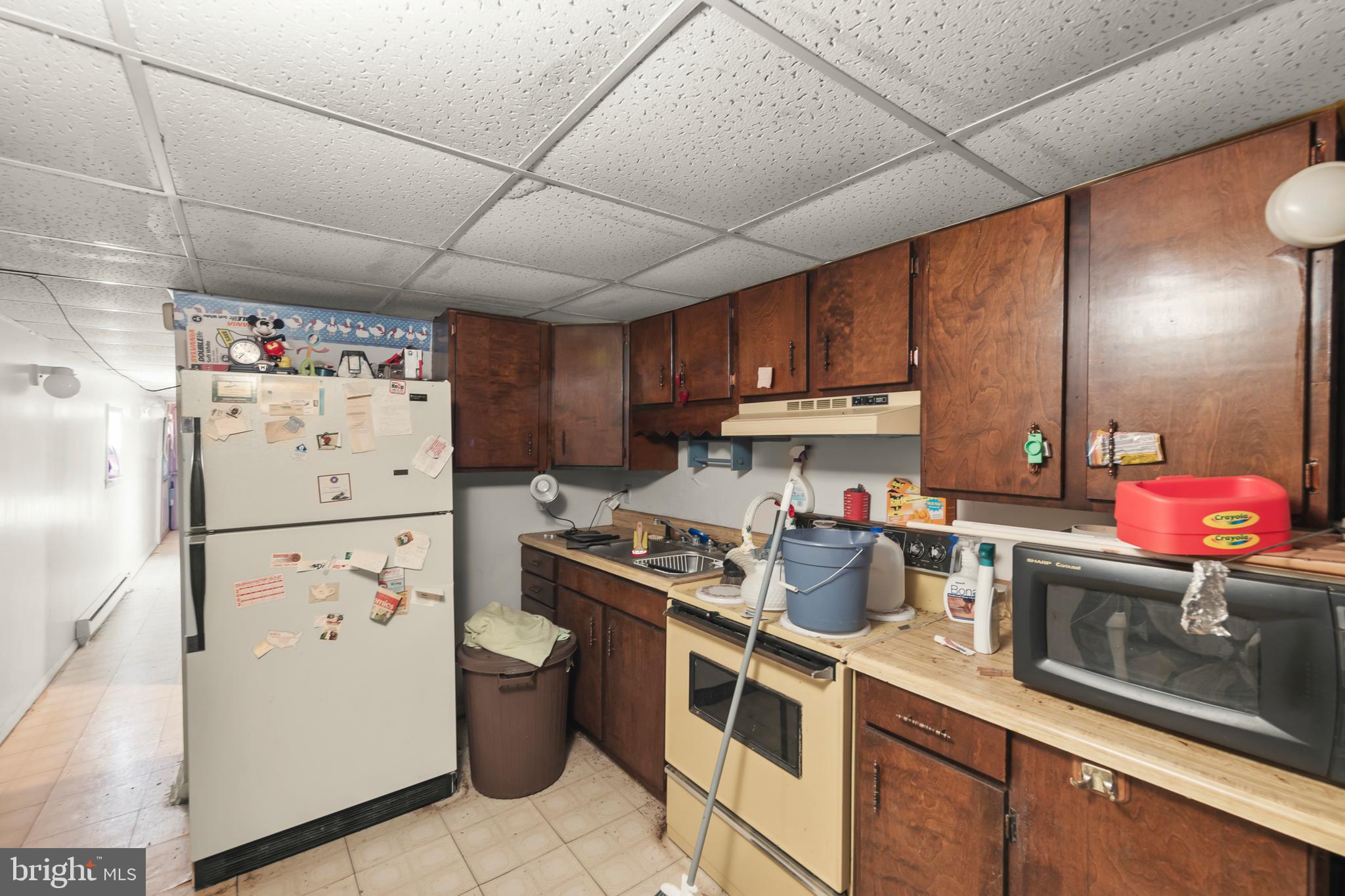 1060 Buffalo Rdg Road Augusta, WV 26704 - Photo 30 of 67 a kitchen with a refrigerator and a sink