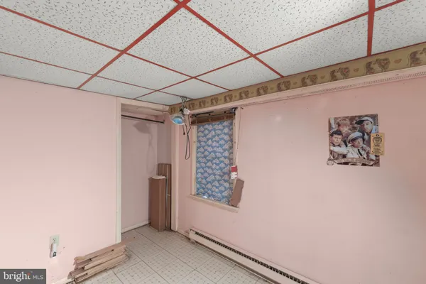 a view of a hallway with living room and utility room