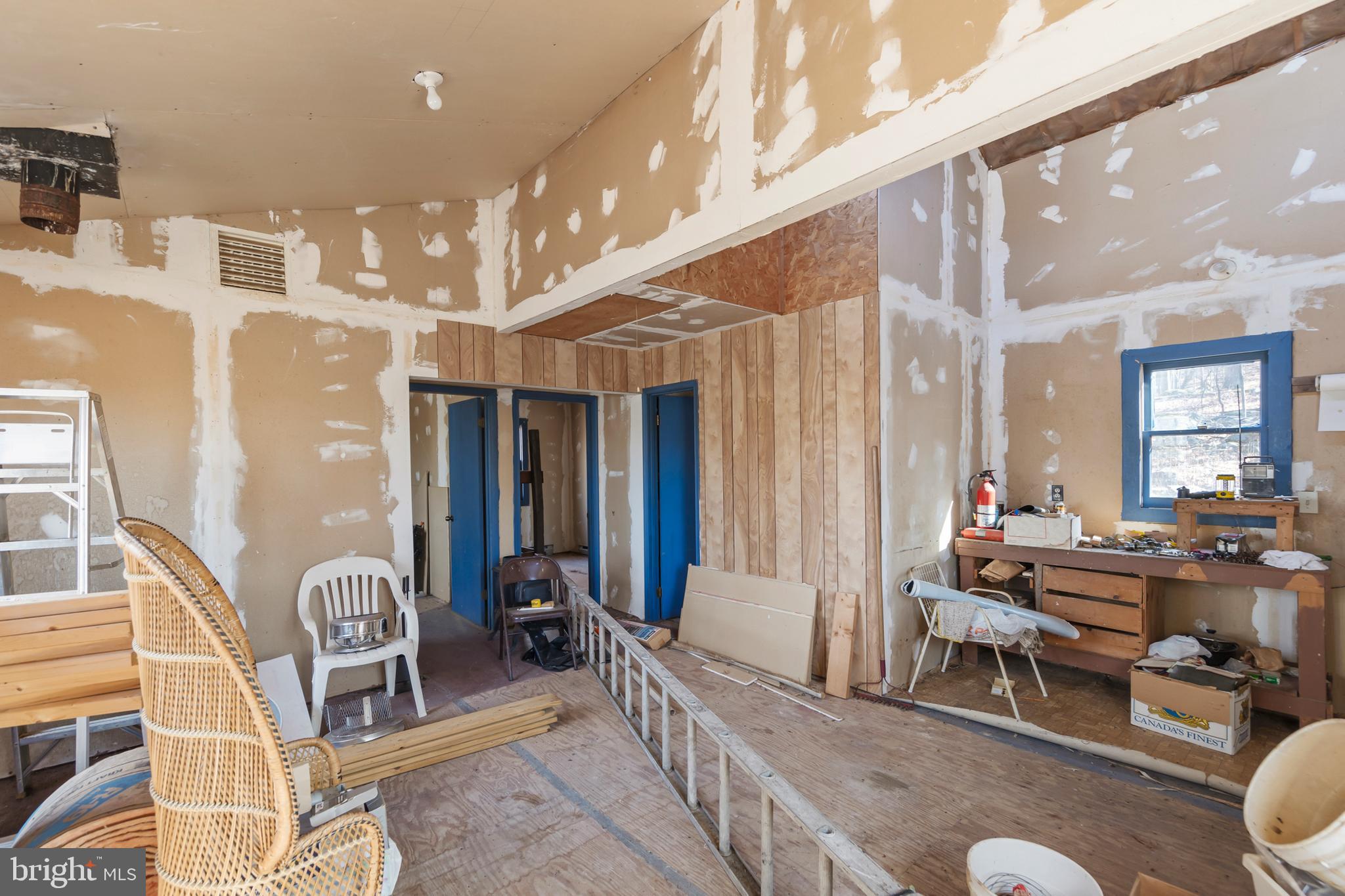 1060 Buffalo Rdg Road Augusta, WV 26704 - Photo 40 of 67 a living room with furniture a couch and large windows
