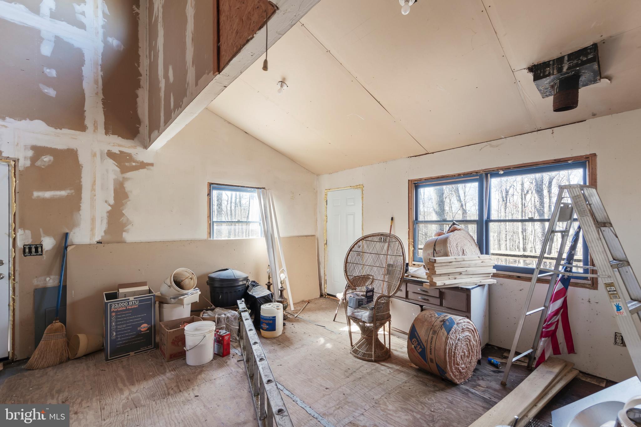 1060 Buffalo Rdg Road Augusta, WV 26704 - Photo 41 of 67 a living room with patio furniture and a large window
