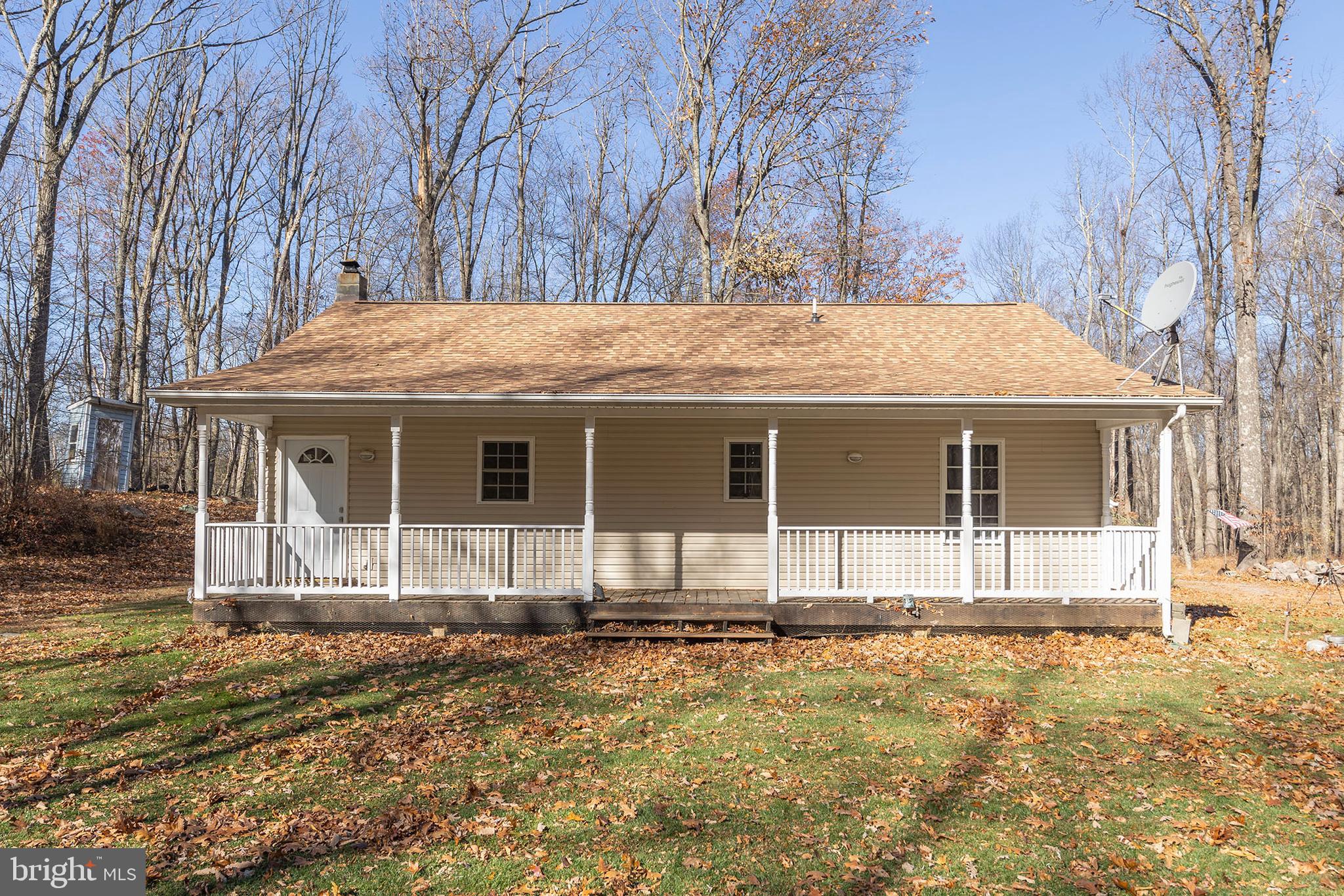 1060 Buffalo Rdg Road Augusta, WV 26704 - Photo 5 of 67 a front view of a house with a yard