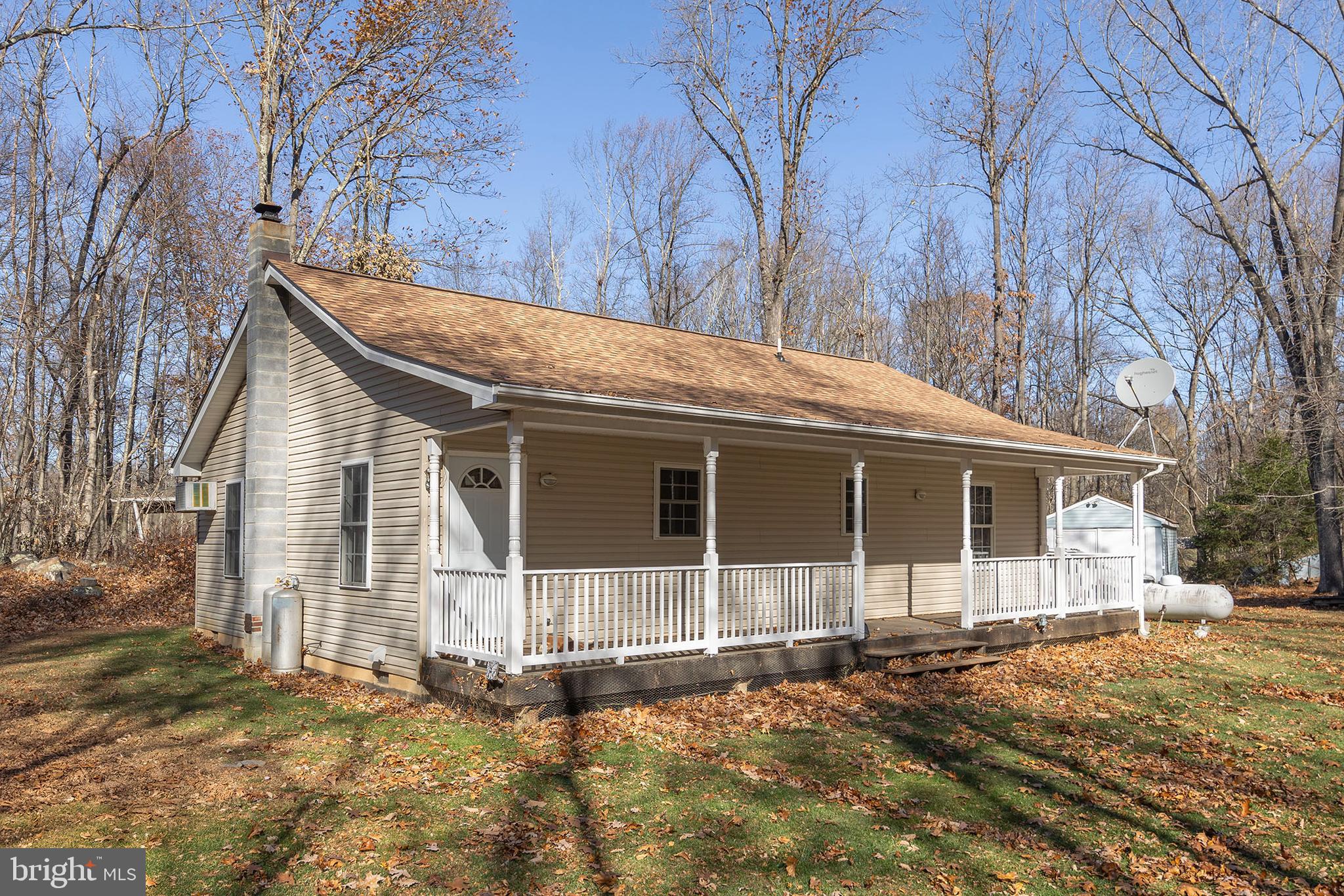 1060 Buffalo Rdg Road Augusta, WV 26704 - Photo 6 of 67 a backyard of a house with large trees and covered with wooden fence
