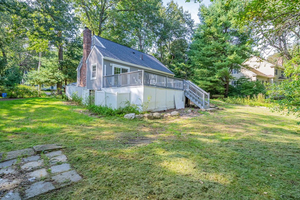 19 Robinson Road Lexington, MA 02420 - Photo 41 of 42 a house is sitting in middle of the green field
