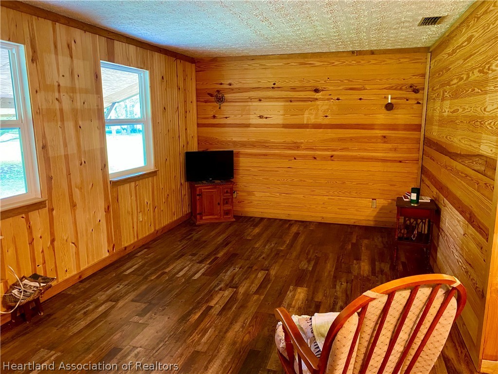538 Hayman Road Wauchula, FL 33873 - Photo 11 of 21 a view of empty room with wooden floor and fan