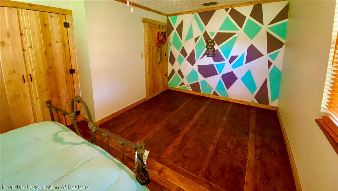 538 Hayman Road Wauchula, FL 33873 - Photo 15 of 21 a bedroom with a bed and a curtain