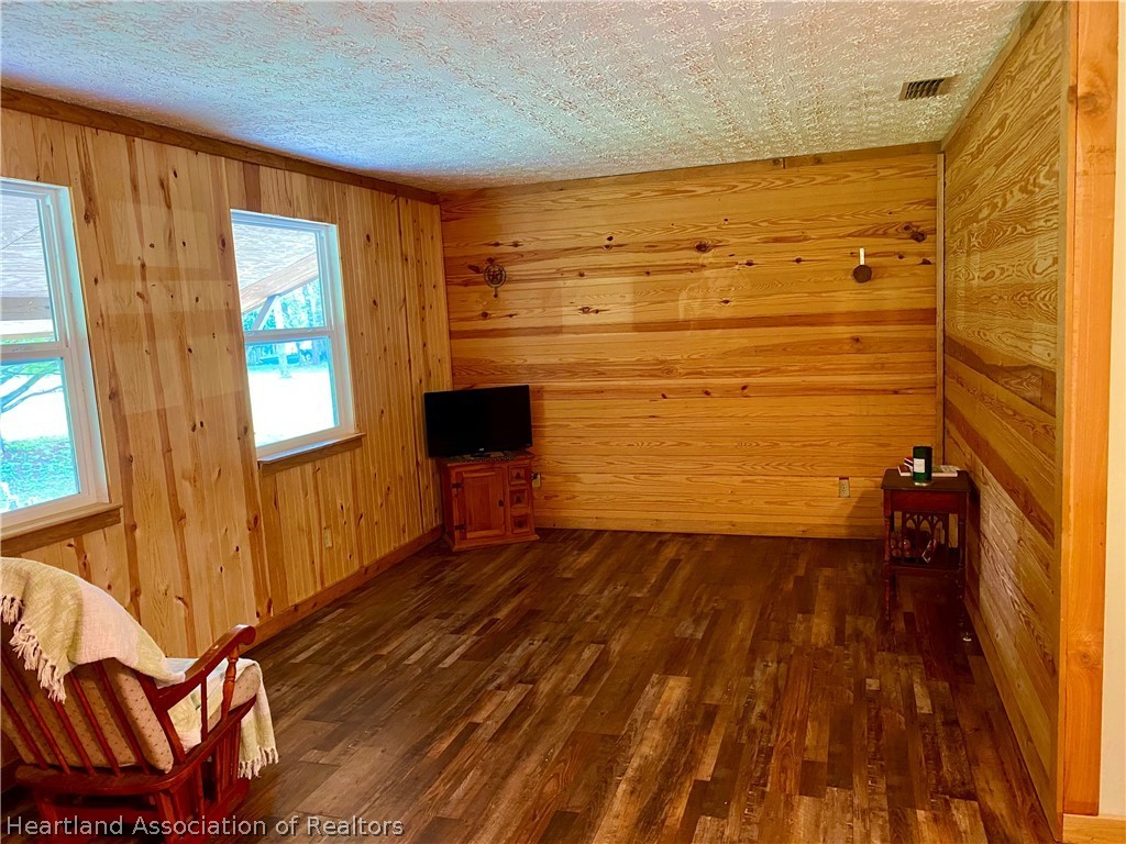 538 Hayman Road Wauchula, FL 33873 - Photo 9 of 21 a view of empty room with wooden floor and fan