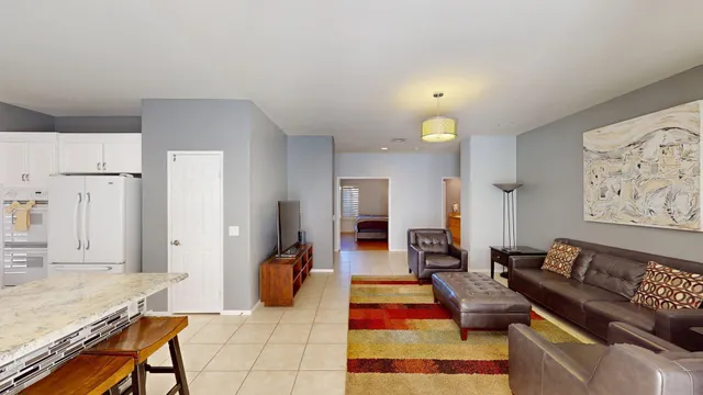 a en suite bathroom with a sink mirror and shower