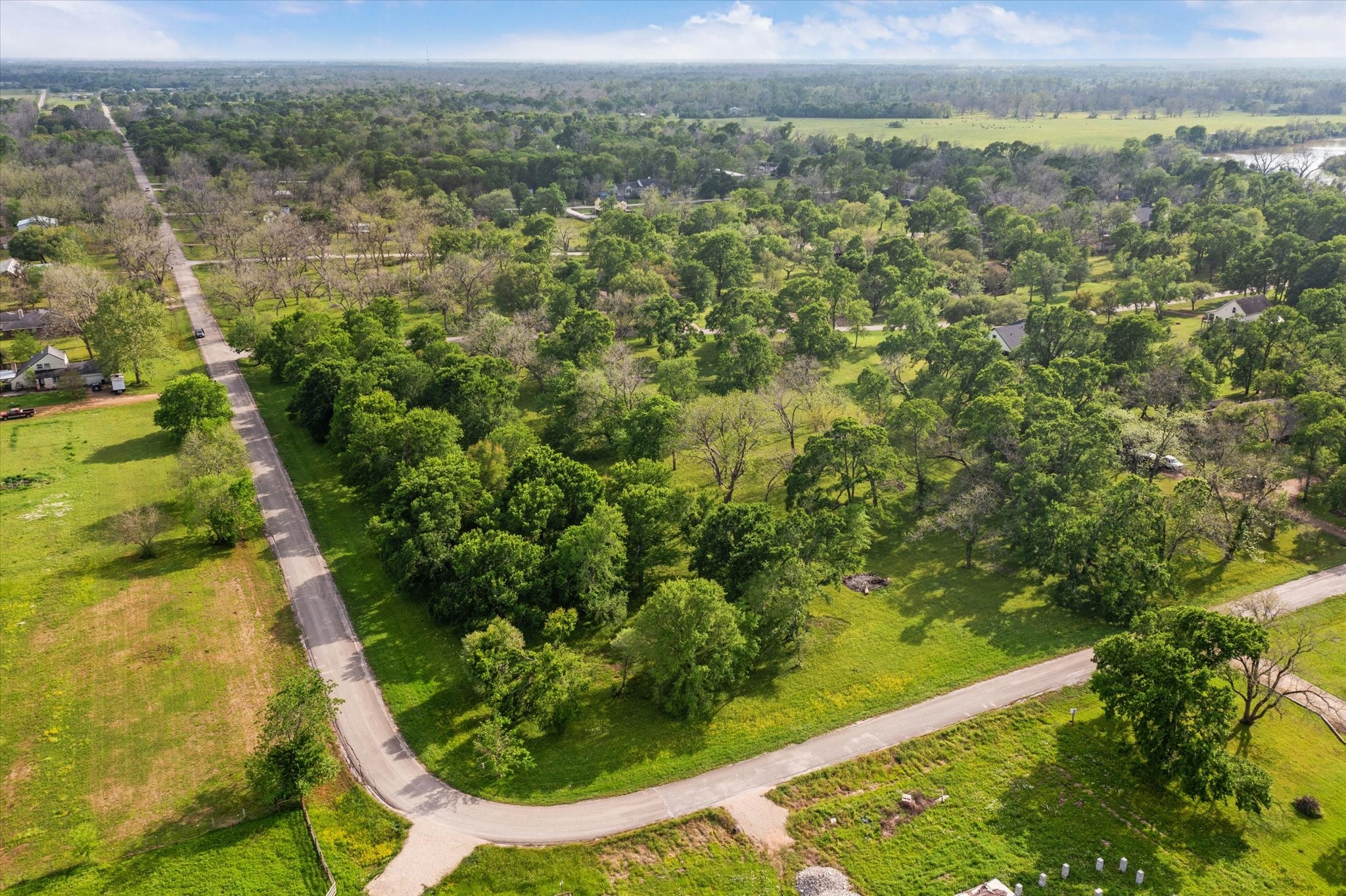 Lot 7-tbd Lot 7-tbd Wagon Road Wallis, TX 77485 - Photo 4 of 13 an aerial view of residential houses with outdoor space and trees