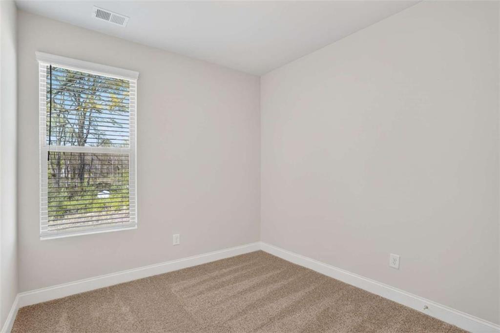 3405 Ripple Loop, Unit 127 South Fulton, GA 30349 - Photo 15 of 26 an empty room with a window