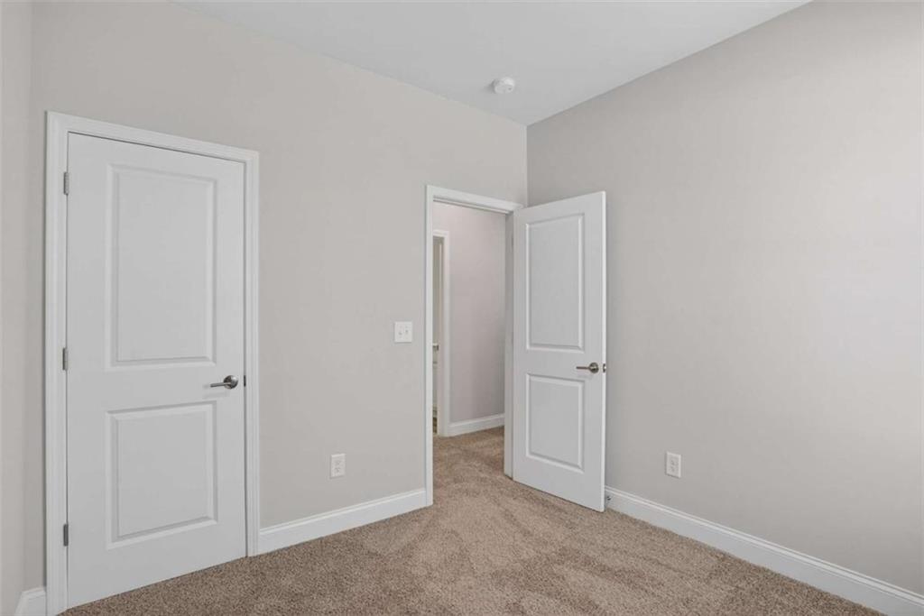 3405 Ripple Loop, Unit 127 South Fulton, GA 30349 - Photo 16 of 26 an empty room with closet area