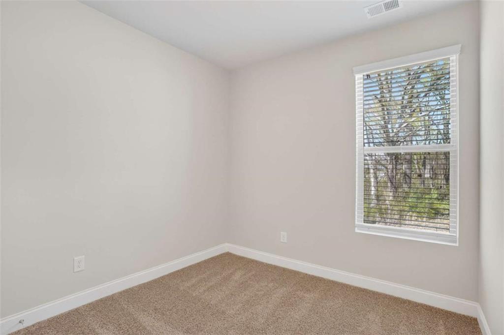 3405 Ripple Loop, Unit 127 South Fulton, GA 30349 - Photo 17 of 26 an empty room with a window