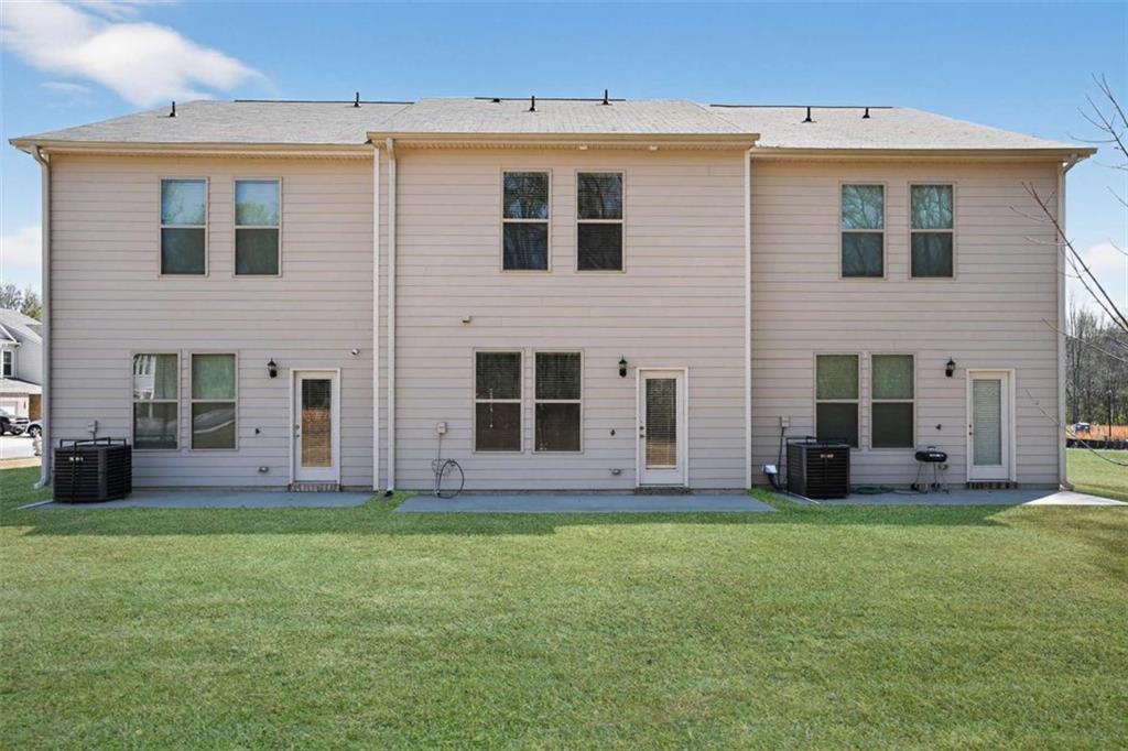3405 Ripple Loop, Unit 127 South Fulton, GA 30349 - Photo 21 of 26 a front view of house with yard and green space
